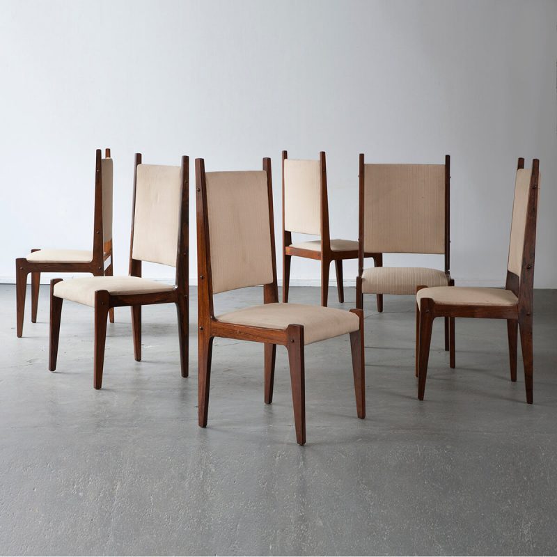 Set of six chairs in jacaranda with upholstered seat and back.