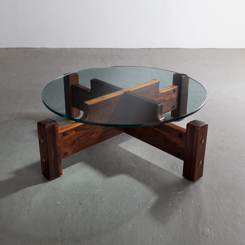 Large round coffee table in solid imbuia with a glass top