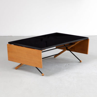 Coffee table in walnut, steel, and plastic laminate with folding leaves