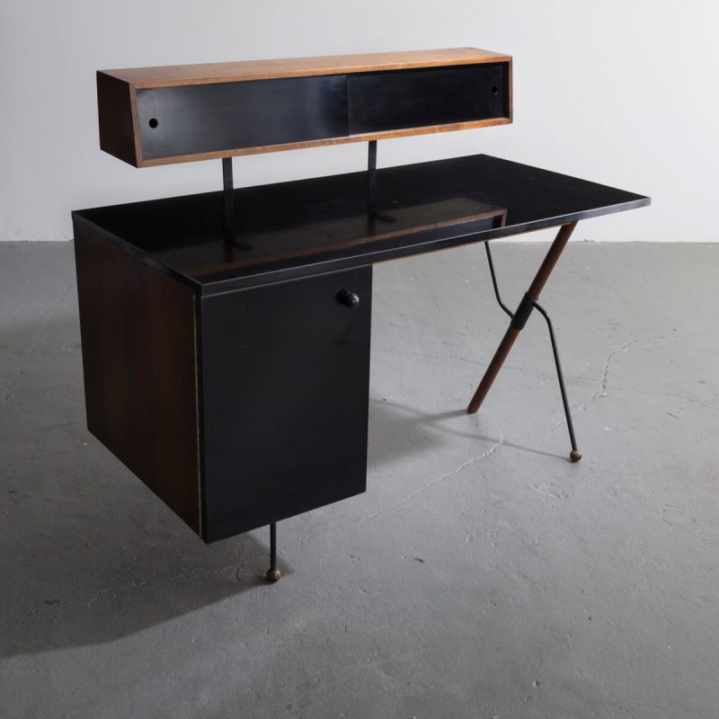 Desk in walnut and wrought iron with pencil box and black laminate surfaces.