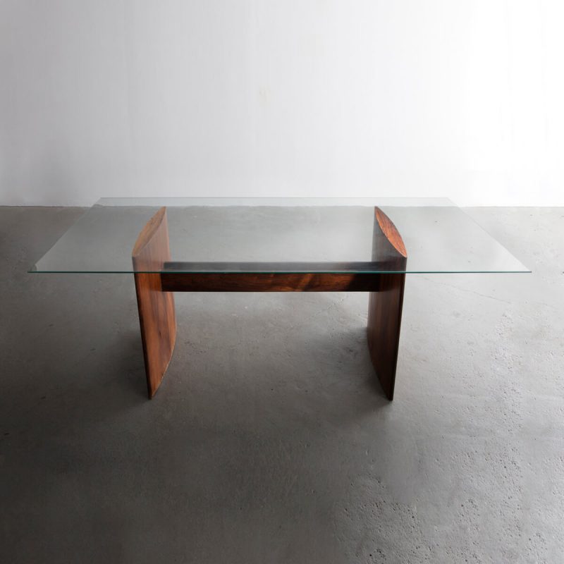 Rectangular dining table with glass top.