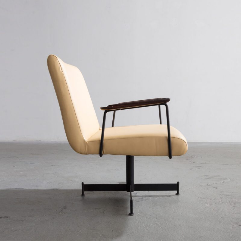 Lounge chair with pale yellow leather upholstery