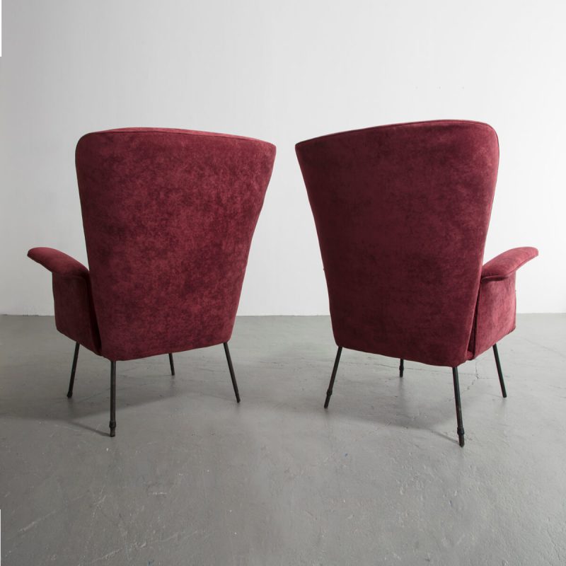 Pair of high-backed armchairs with upholstered seats and iron frame.