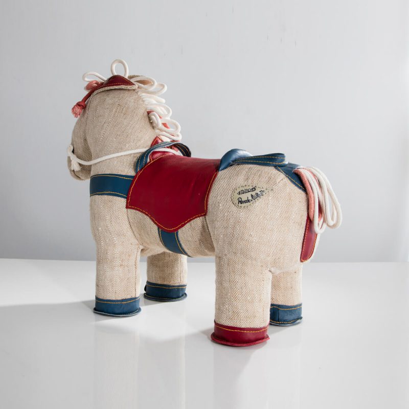 Therapeutic Toy Pony in natural jute with red leather saddle detailing.